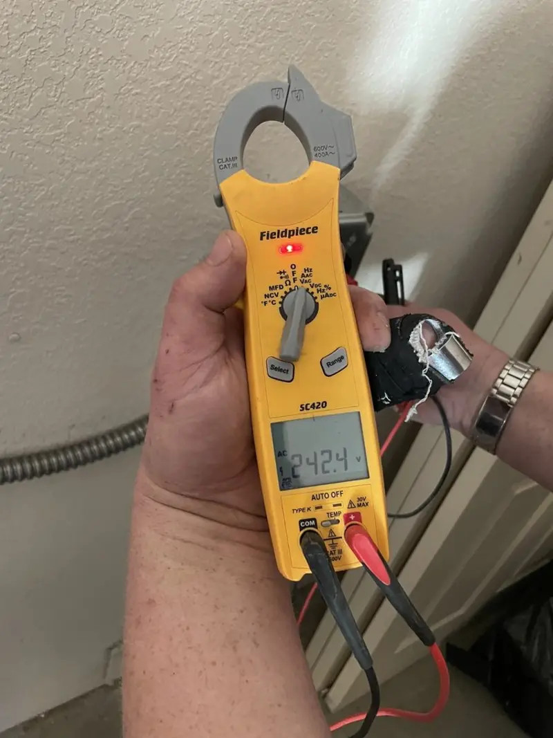 Voltage testing with clamp meter during Ceiling Fan Installation in Hellam